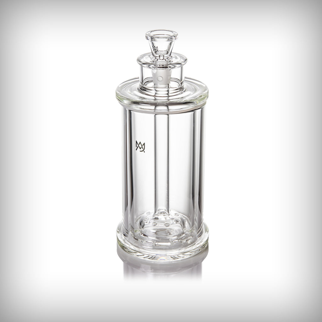 Angled view of the assembled MJ Arsenal Piston Gravity Bong showing its transparent glass construction and internal components.