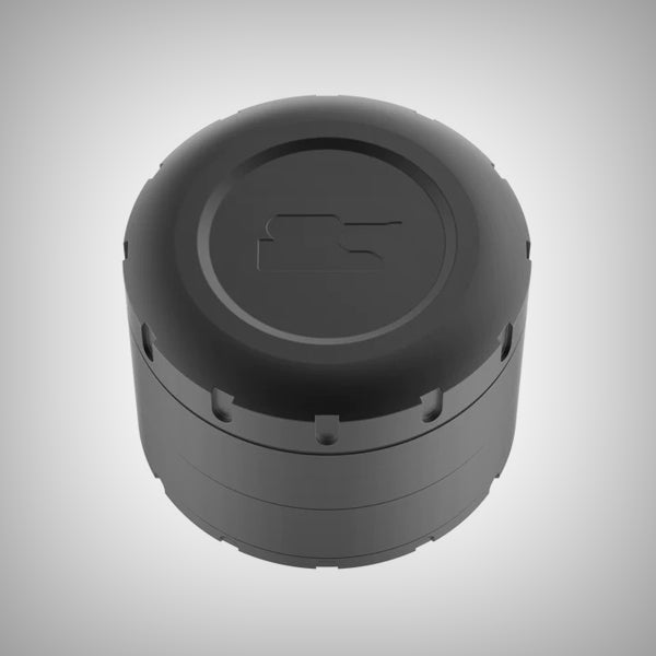 Assembled black Tank ShredStep Grinder standing on a gray surface