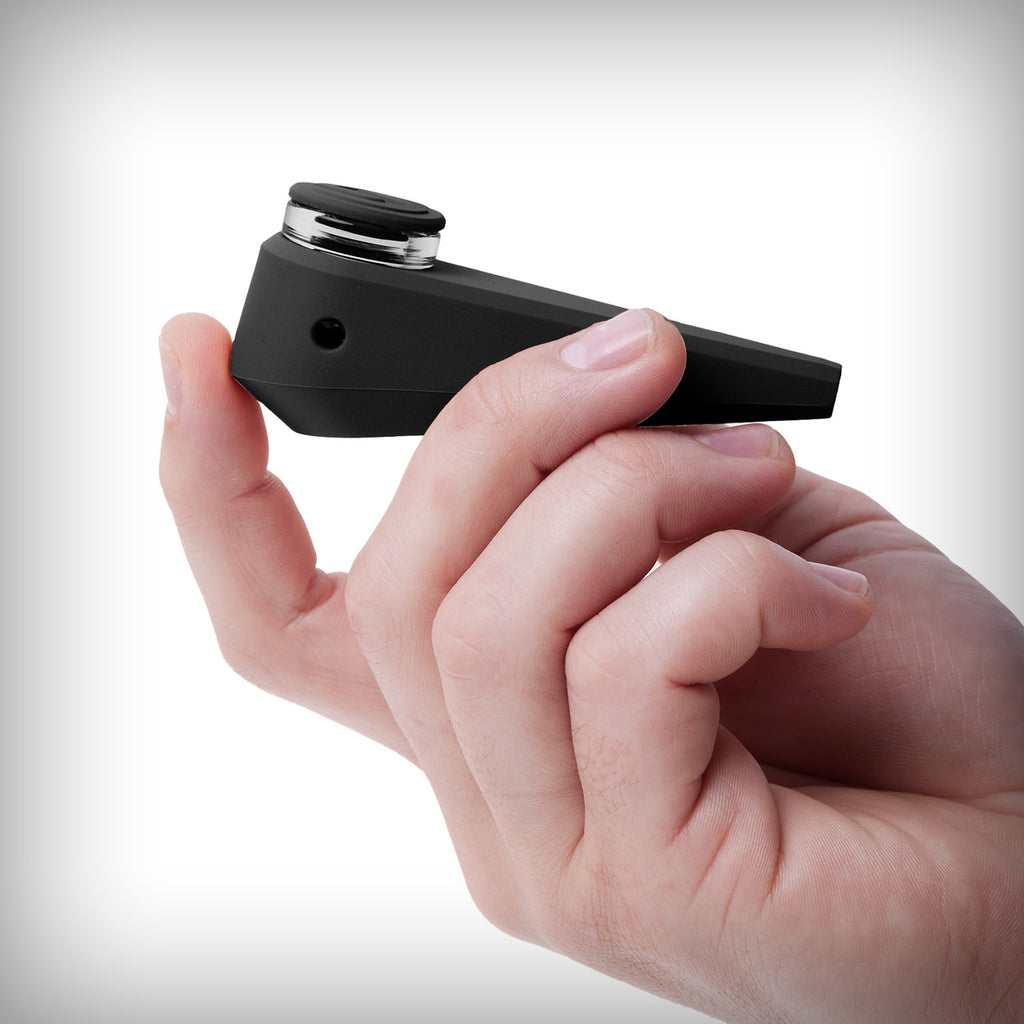 Black Softglass Token Hand Pipe held in one hand for size reference