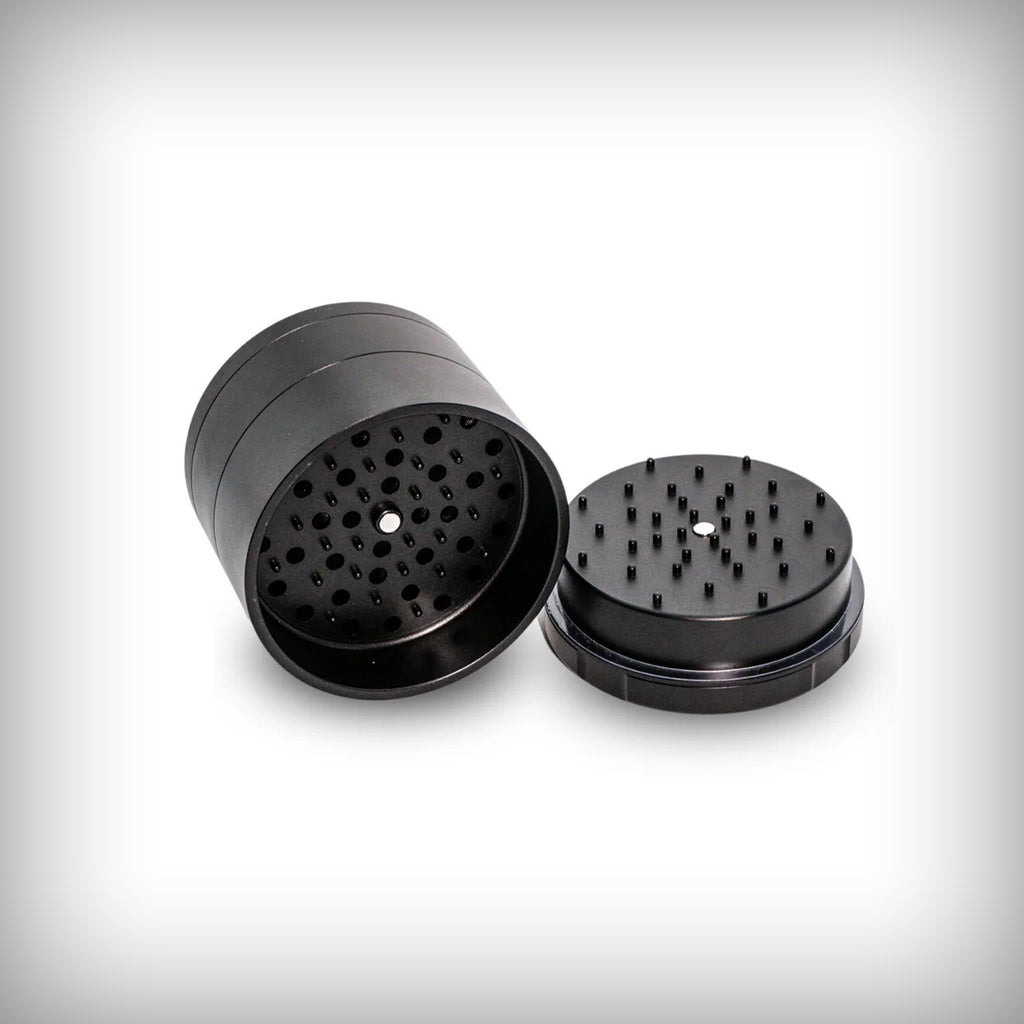 Black Stache Grynder open to show the micro-rounded grinding teeth