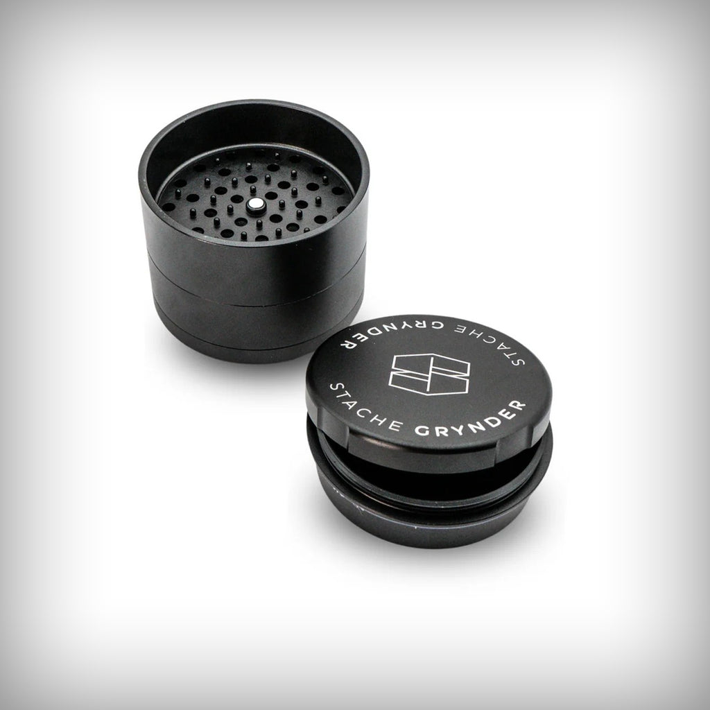 Black Stache Grynder shown open with stainless-steel separation screen