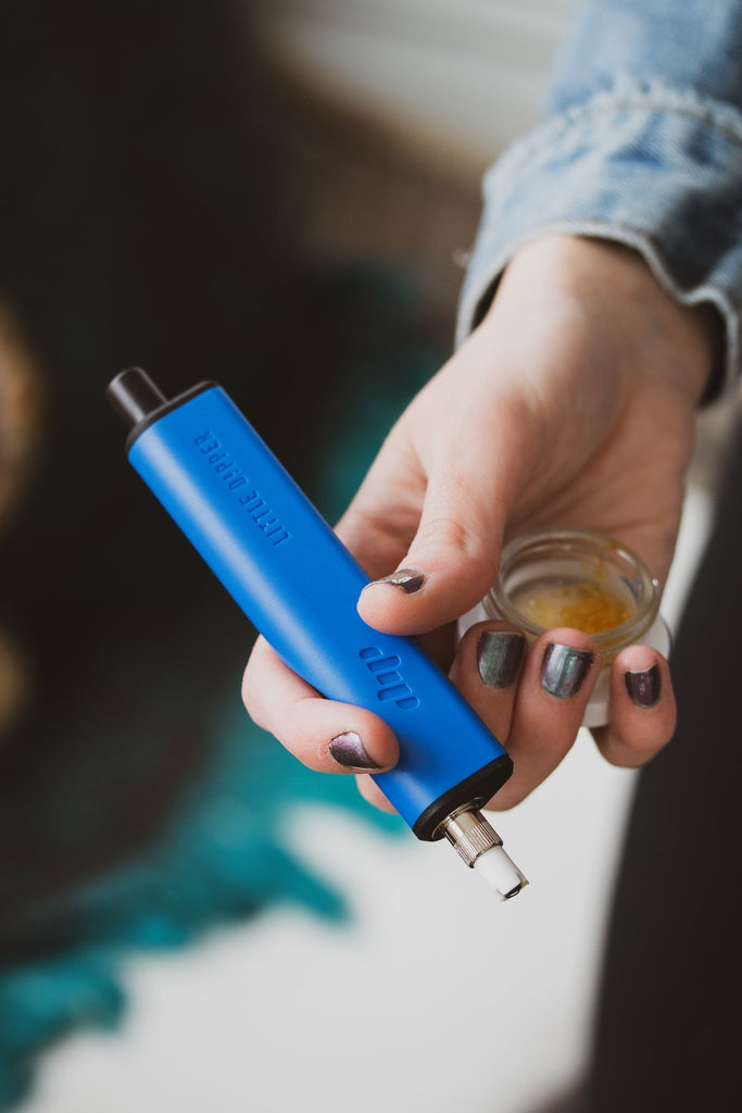 Blue Dip Devices Little Dipper electric nectar collector held in hand