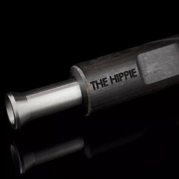 Brown Rosewood Pipe X analog vaporizer held horizontally in hand