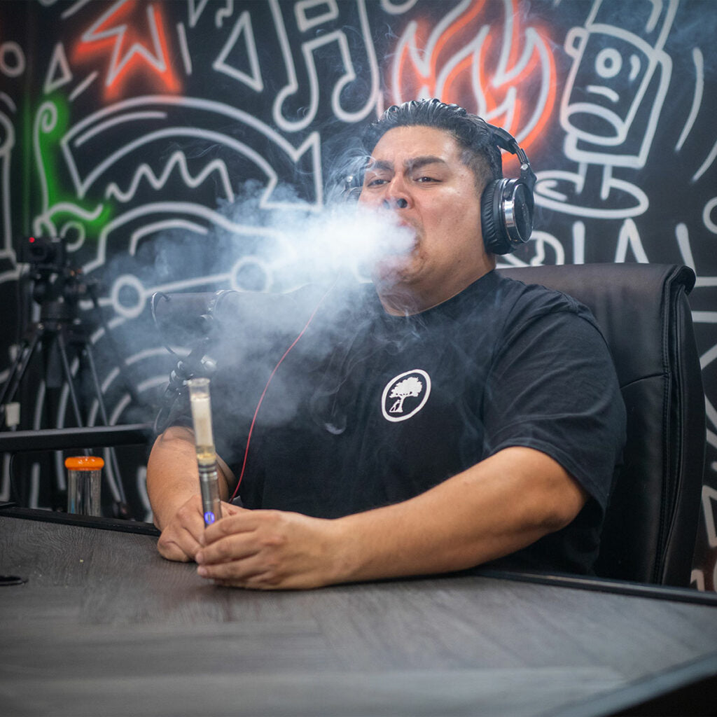Cipher NOVA V3 electric smoking pipe being used during a podcast