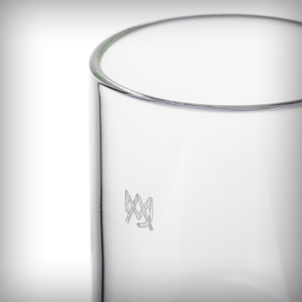 Clear cylindrical glass shell of the MJ Arsenal Altitude Gravity Bong with visible brand logo