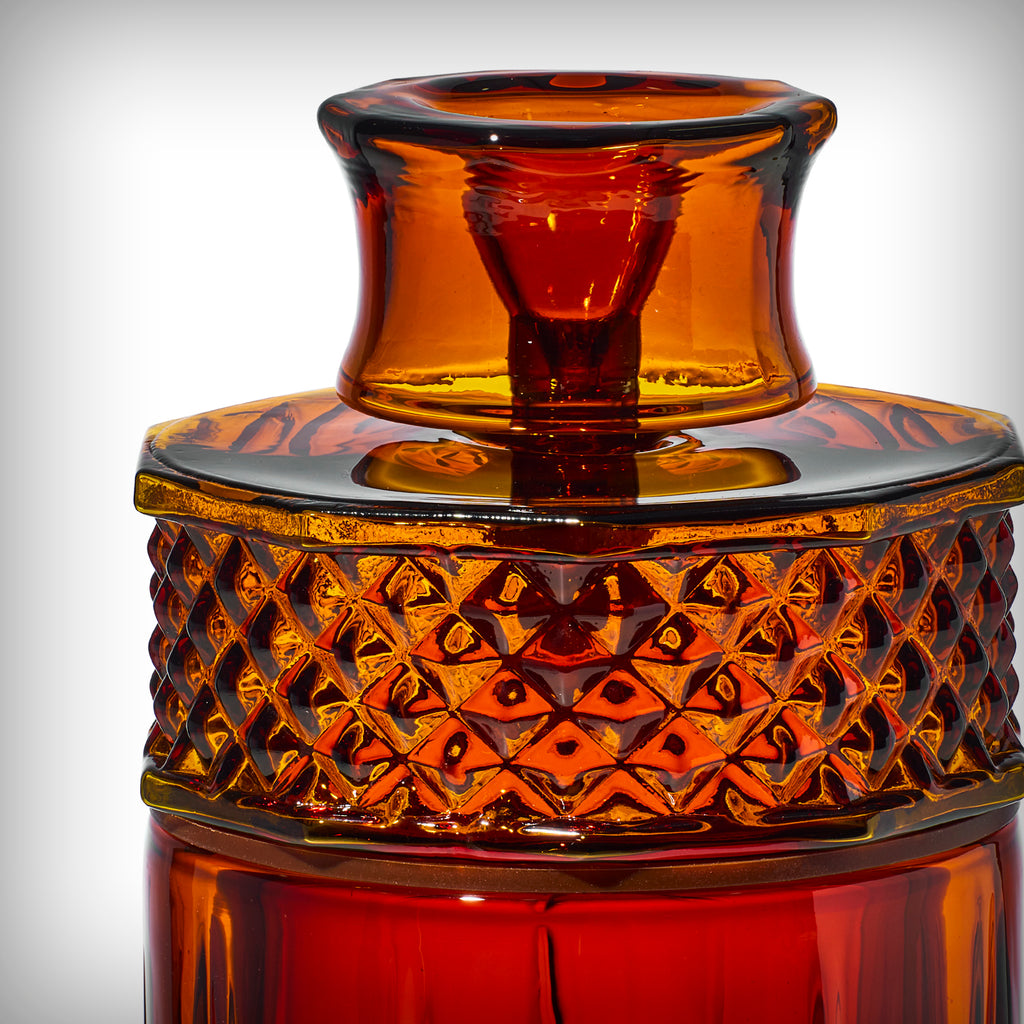 Close-up of Baltic Amber NWTN Home Highball Gravity Bong textured glass top