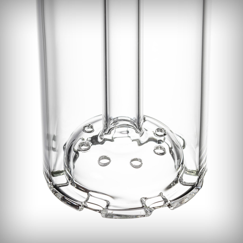 Close-up of the MJ Arsenal Piston disc percolator showing its circular glass surface and multiple openings.