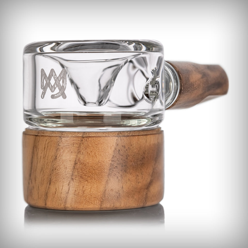 Close-up side view of MJ Arsenal Granby Hand Pipe glass body and walnut base