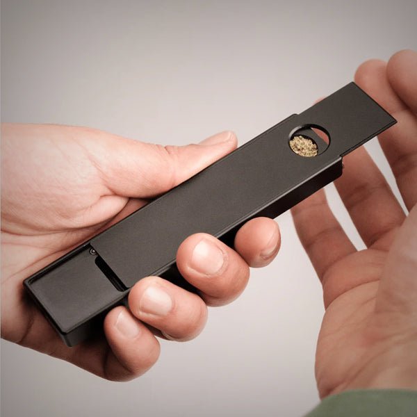 Discreet metal smoking pipe with built-in poker