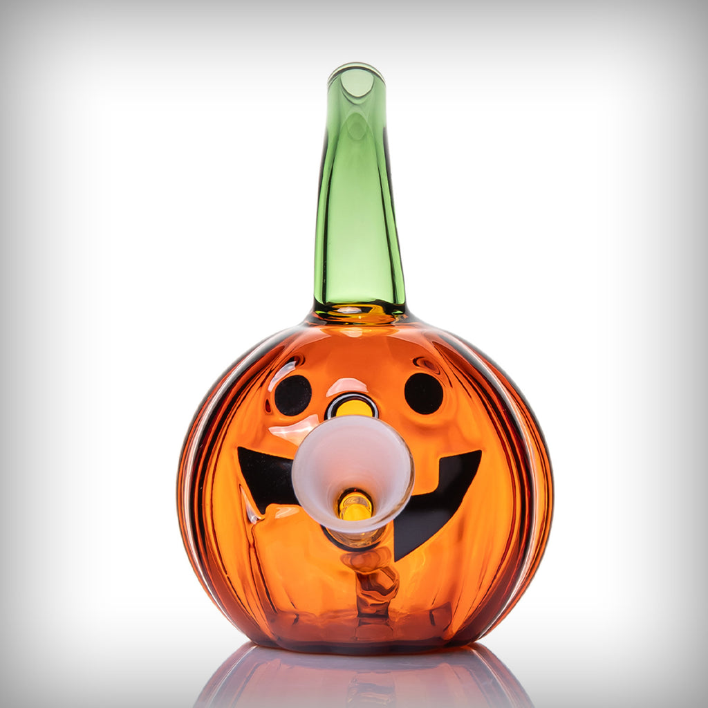 Front view of MJ Arsenal Jack O'Ripper Blunt Bubbler with jack-o'-lantern face and glass holder