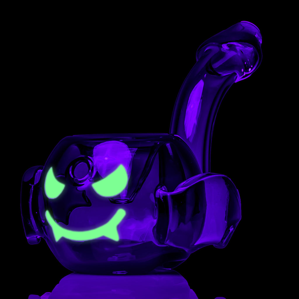 Front view of the MJ Arsenal Bat Hand Pipe glow-in-the-dark face