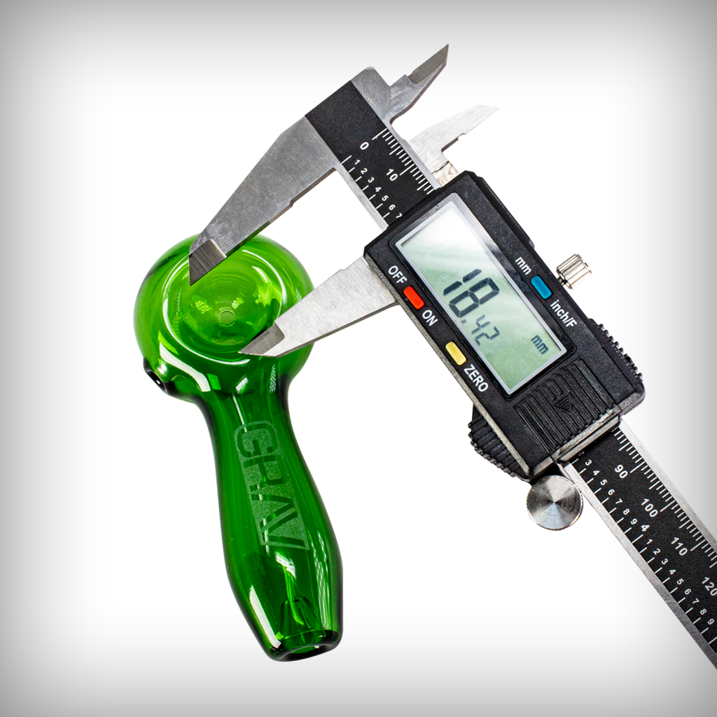 GRAV Classic Spoon green glass hand pipe shown with a digital caliper