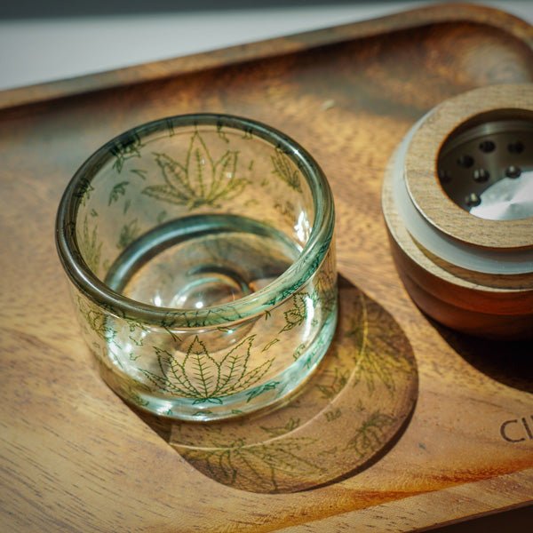 Glass herb grinder with black walnut lid and aluminum teeth