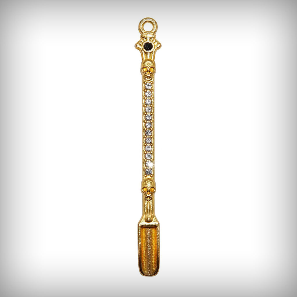 Gold Digger miniature shovel pendant with skull details and clear decorative stones
