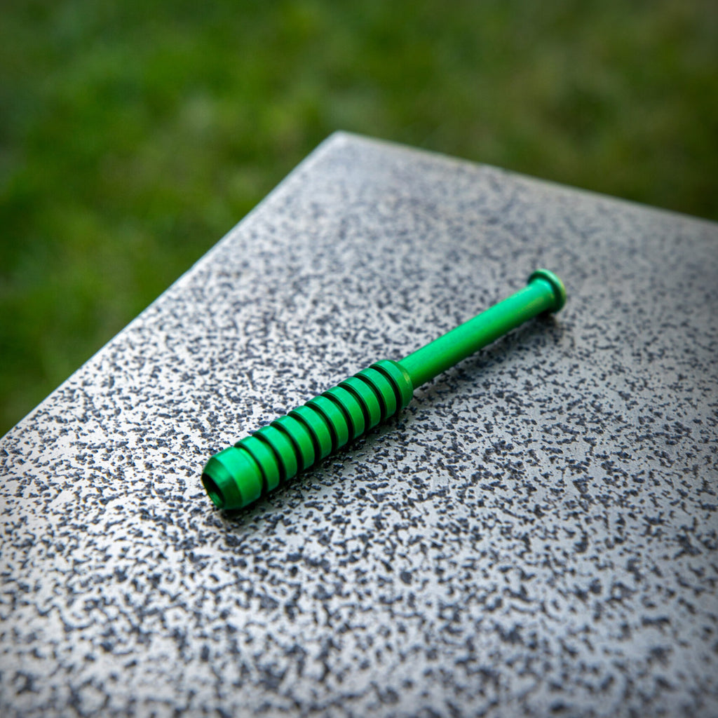 Green metal one hitter pipe by The Mill