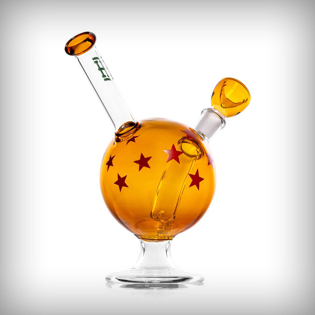 HEMPER Wish Ball water pipe angled view showing amber glass body, red stars, bowl, and mouthpiece
