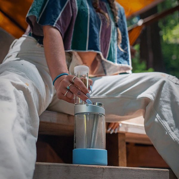 Honest Capsule Water Pipe shown in a seated lifestyle setting
