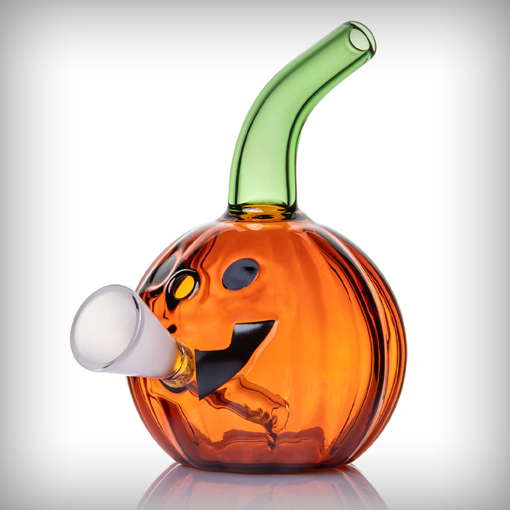 MJ Arsenal Jack O'Ripper Blunt Bubbler angled view showing jack-o'-lantern face and side glass holder