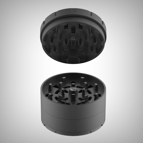 Open Tank ShredStep Grinder on a gray surface with lid resting beside it