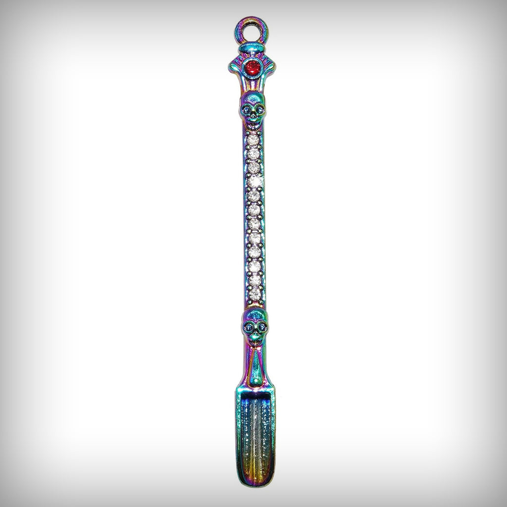 Rainbow Digger miniature shovel pendant with skull details and clear decorative stones
