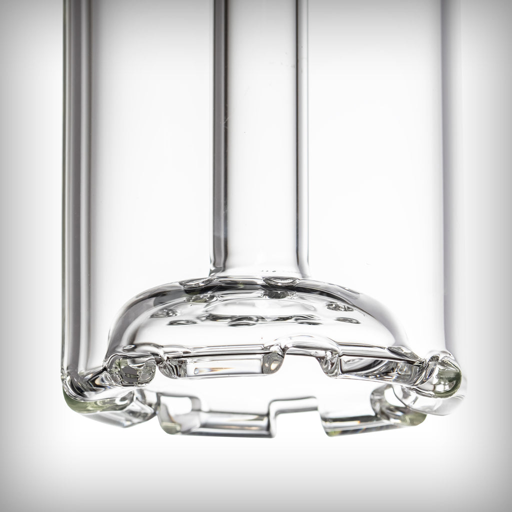 Side close-up of the MJ Arsenal Piston Gravity Bong disc percolator inside the clear glass cylinder.