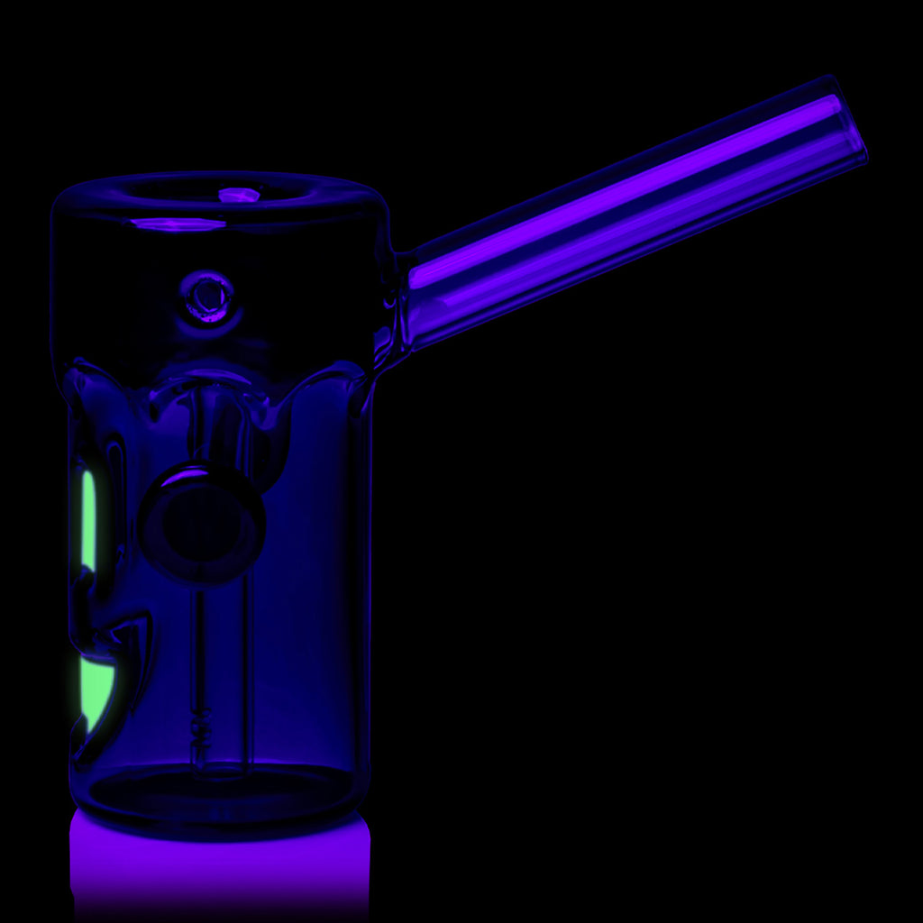 Side view of MJ Arsenal Frankenbubbler illuminated under dark lighting