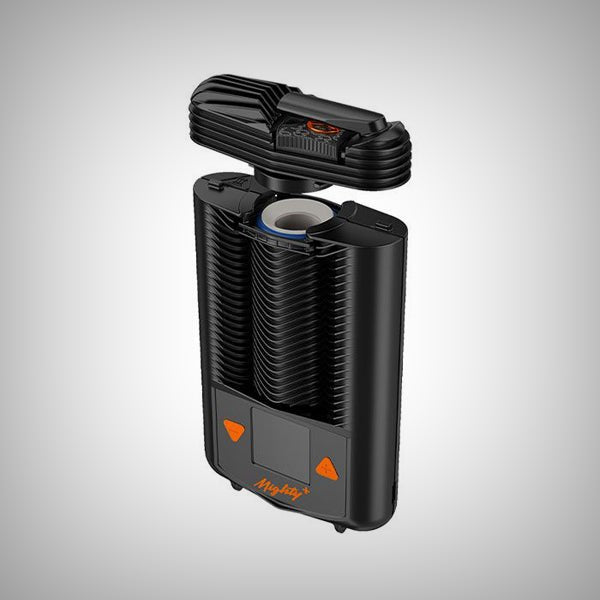 Side view of STORZ & BICKEL MIGHTY+ Vaporizer showing the orange power button