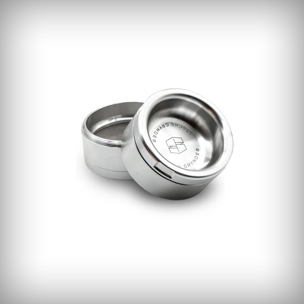 Silver Stache Grynder open to show the interior collection chamber