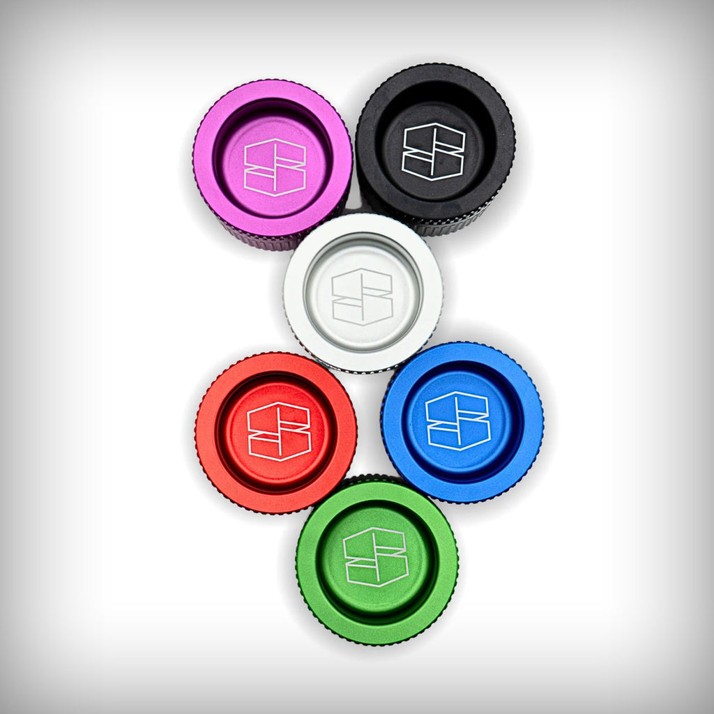 Stache Grynder 360 grinders shown in multiple color finishes