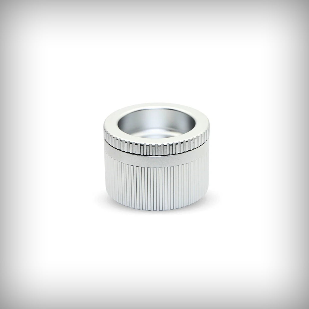 Stache Grynder 360 silver grinder shown from an angled view
