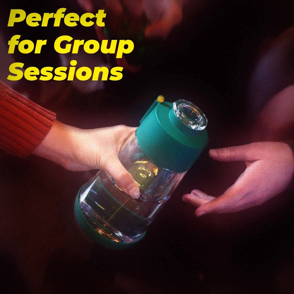Weday Forest Gravity Bong held in hand during a group-session lifestyle scene
