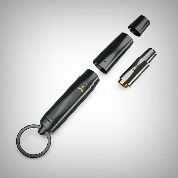 AirVape OM keychain vaporizer disassembled showing removable components and key ring